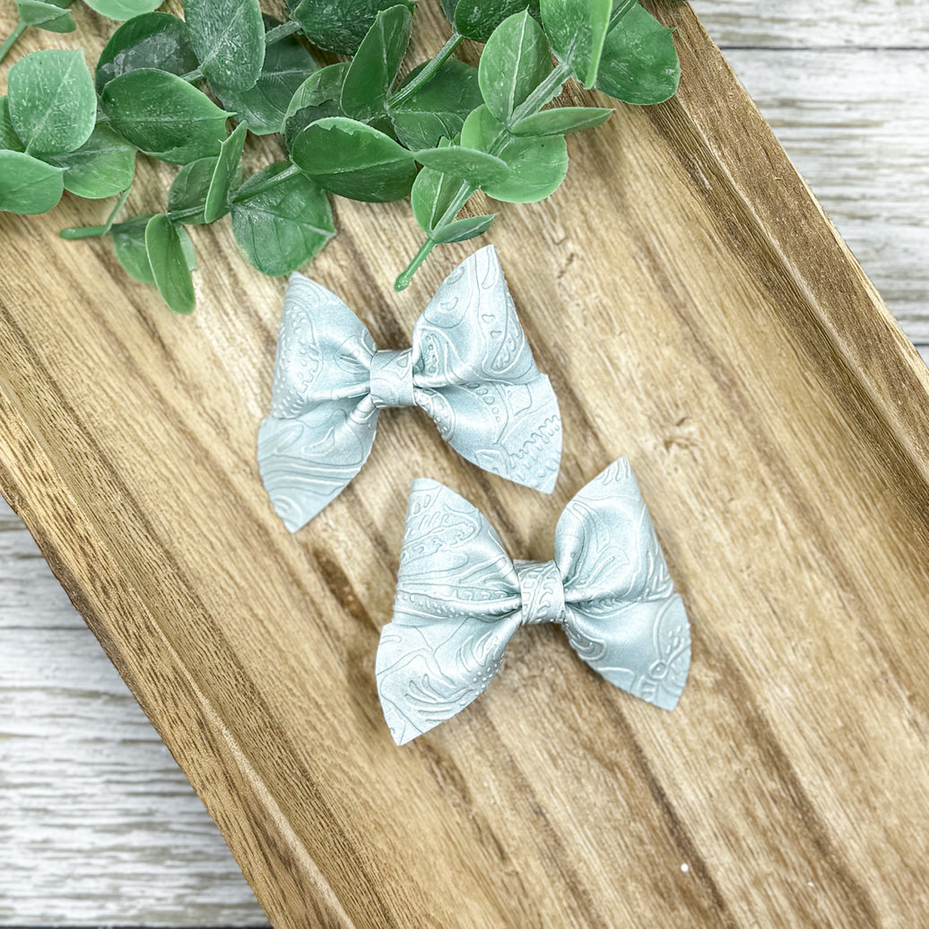 Pastel Blue Embossed Itty Bitty Piggies